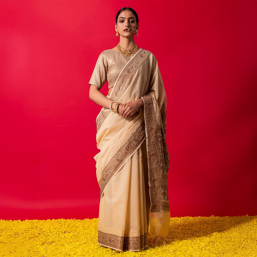Triyah The Royal Cream Muga Silk Saree With Unstitched Blouse Fabric